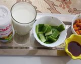 A picture of step 1 of Masala chaach (Peeled cucumber and peanut).