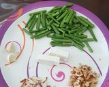 A picture of step 1 of French beans tossed with nuts and feta cheese salad.