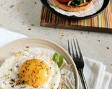 A picture of step 1 of Sunny side up eggs with garlic spinach and roasted tomato.