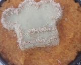 A picture of step 7 of Carrot cookpad logo cake.