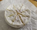 A picture of step 2 of Baked Camembert with Confit Tomatoes and Garlic Bruschetta.