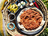 برغل على بندورة بالقاورما على الحطب