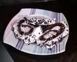 A picture of step 12 of Chocolate swiss roll.