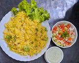 A picture of step 5 of Alu Biryani with kachumar salad.