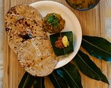 A picture of step 13 of Maharashtrian Lunch Thali of Bhakri, Vangyache Bharit, Phodniche Varan, Gul aani Tup.
