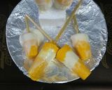A picture of step 8 of Indian frozen dessert mango bar(popsicle) with curd.