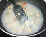 A picture of step 9 of Stuffed clams gravy.