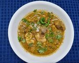 A picture of step 4 of Lonka Roshun Pora Masala Chicken.