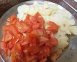 A picture of step 2 of Potato green onion tomato veg.