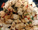 A picture of step 3 of My Salt n Chilli Peppered Chicken on a folded flatbread. 😋.