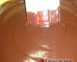 A picture of step 12 of Karidopita with pudding and chocolate glaze.