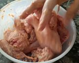 A picture of step 1 of Chicken 65 with sauce/Gravy.