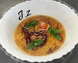 A picture of step 1 of Moong Masoor Daal (red and yellow lentils).