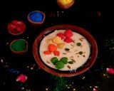 A picture of step 4 of Rabdi with colourful coconut ladoo.