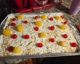 A picture of step 9 of Pina Colada Poke Cake.