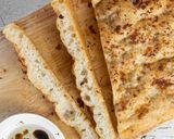 A picture of step 7 of Overnight 89% Hydration Garlic and Rosemary Focaccia.