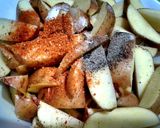 A picture of step 2 of Spicy baked potatoes wedges.