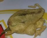 A picture of step 6 of Masaly bhari hari mirch k pakoray.