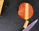 A picture of step 3 of My cheese wrapped in Pepperoni and Savoury Crackers 🤩.