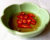 Hình bước làm 6 của món Canh cải chua nấu với lườn cá hồi