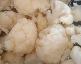 A picture of step 1 of Cauliflower Cheese rolled in breadcrumbs.