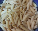 A picture of step 1 of Pink cheese pasta with garlic bread.