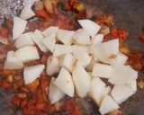 A picture of step 2 of Aloo Gobhi Matar curry.