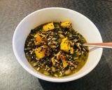 A picture of step 12 of White Bean and Swiss Chard Egusi Soup with seed coated Polenta bites.