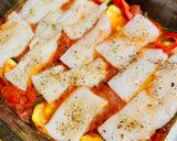 A picture of step 3 of Cod with vegetables in the oven.