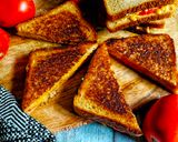 A picture of step 3 of Cheese and Tomato Grilled Sandwich.