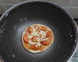 A picture of step 5 of Cheesy Mini Macaroni Pasta Pizza.