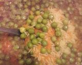 A picture of step 3 of Rice with Carrots and Peas.