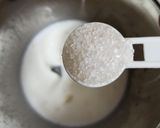 A picture of step 2 of Milkybar milk shake.