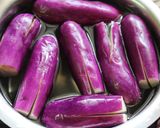 A picture of step 1 of Andhra Style Gutti Vankaya Pulusu Koora /Stuffed Brinjal Gravy Curry.