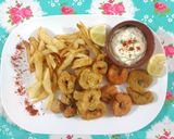 Foto del paso 7 de la receta: Frutos de mar: Rabas, langostinos y camarones fritos