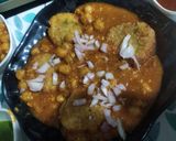 A picture of step 10 of Chole ragda with potato pattice.
