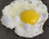 A picture of step 3 of Sunny side up egg with toasted bread.