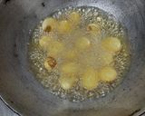 A picture of step 1 of Dum aloo.