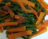 A picture of step 4 of Fried carrots and french beans.