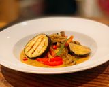 A picture of step 9 of Beef and grilled aubergine red curry topped with Bird eye chillis.