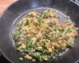 A picture of step 11 of Scrambled Eggs with Green Peppers, Red Onion, and Coulommiers Cheese.