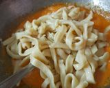 A picture of step 5 of Homemade Fettuccine pasta with arebita source.