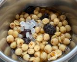 A picture of step 7 of Black Date, Snow Fungus, and Lotus Seed Sweet Soup.