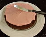 A picture of step 15 of Dark Chocolate Layer Cake with Fresh Strawberry Cream Frosting and Filling.