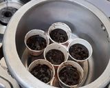 A picture of step 4 of Chocolate cup cakes with harshley Syrup and choco chips.