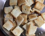 A picture of step 1 of Chatpata Bread Upma in red sauce.