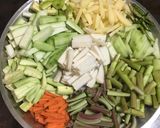 A picture of step 1 of Lentil Fritters in mix veg curry.