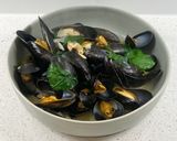 A picture of step 4 of Mussels in a white wine, butter, garlic and parsley sauce.