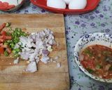 A picture of step 3 of Schezwan chutney brown Bread 🍞 tomato 🍅 onion omellete.