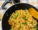A picture of step 5 of Veg Hakka noodles with spring onions.
